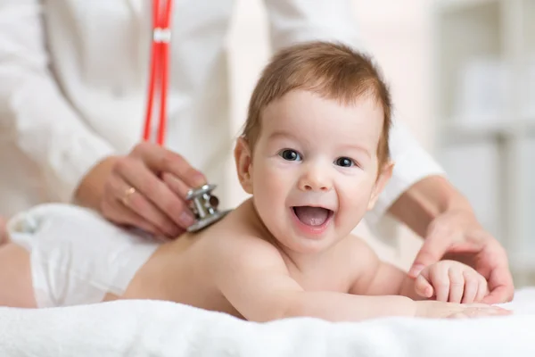 pediatrician-doctor-examines-baby-with